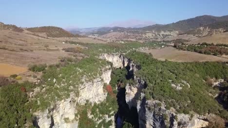 rising above looking it osumi canyon with bright blue skies travelling around albania on a road trip in europe