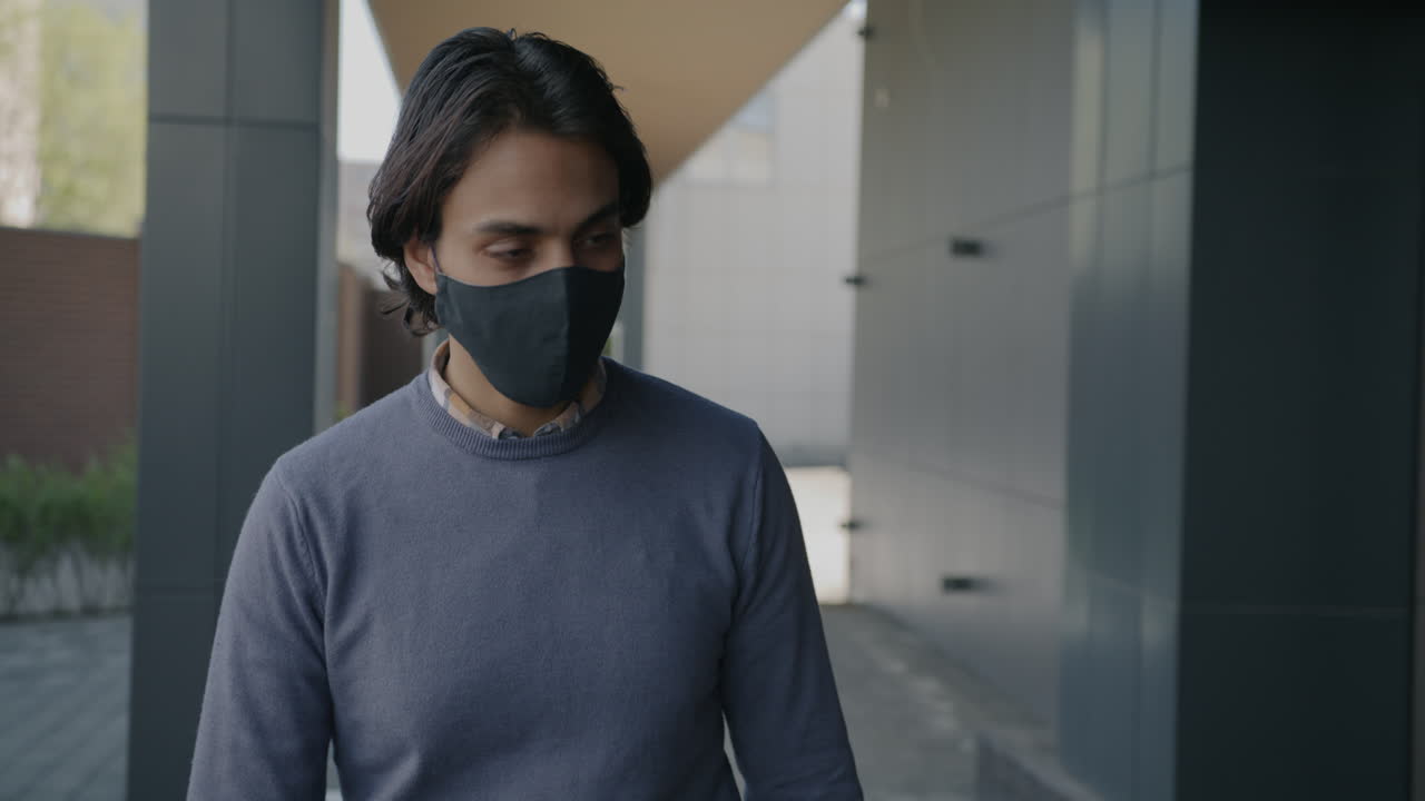 Man wearing a mask outdoors