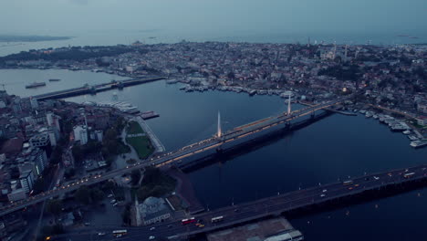 Aerial-drone-flight-of-the-three-bridges-over-the-river-of-Istanbul-city-in-europe-on-a-cloudy-and-grey-day,-slow-motion-and-copy-space