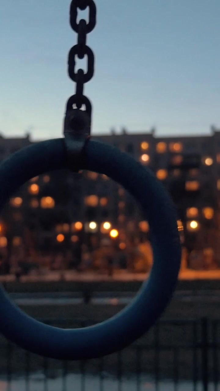Sports ring on apartment block background in late evening