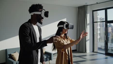 couple experiencing virtual reality in modern apartment