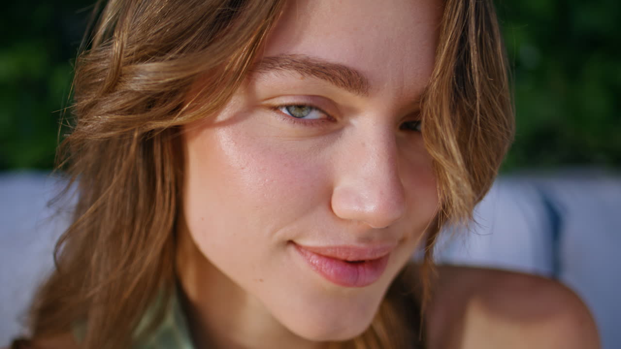 Closeup cheerful woman smiling gently surrounded by green ivy leaves. Happy lady