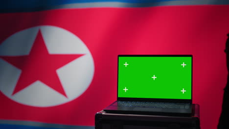 pyongyang regime army soldier scanning rockets with chroma key notebook