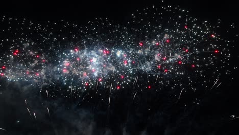 long time seamless loop of real colourful fireworks festival display at night during national holiday, new year party 2022