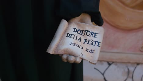 17th-century-plague-doctor-sign,-Ca-'Macana,-Venice-Italy