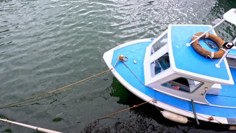 a small boat floating in calm waters