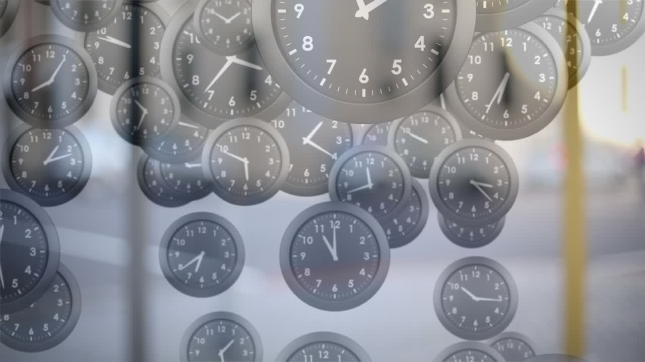 Animation of multiple ticking clocks falling against blurred view of city traffic
