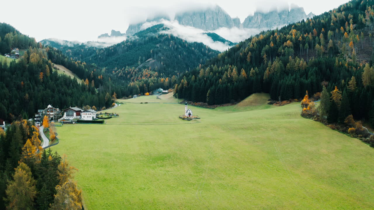 Autumnal Alpine Village and Church in the Dolomites