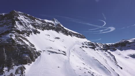 Stunning-drone-footage-high-over-a-ski-run-in-the-Swiss-Alps