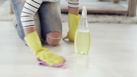 woman cleaning a wood floor