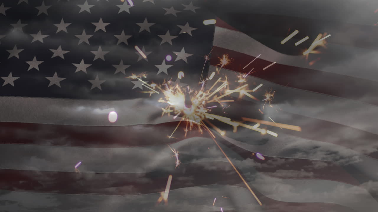 Animation of glowing sparkler and clouds on sky over american flag
