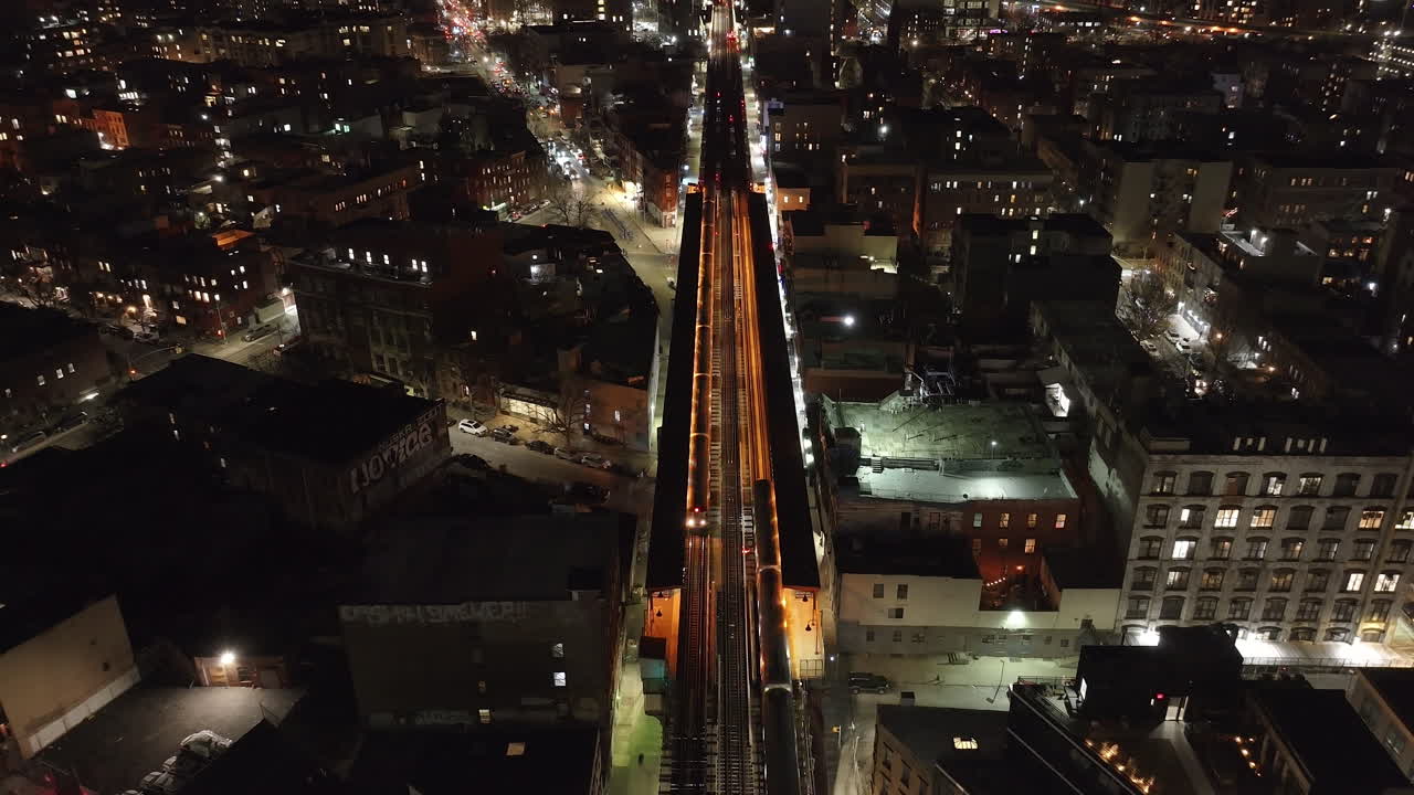 Aerial view of the subway passing through Brooklyn at night