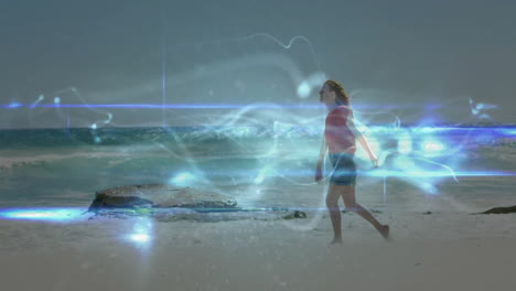 woman walking on beach with glowing abstract light animation surrounding her