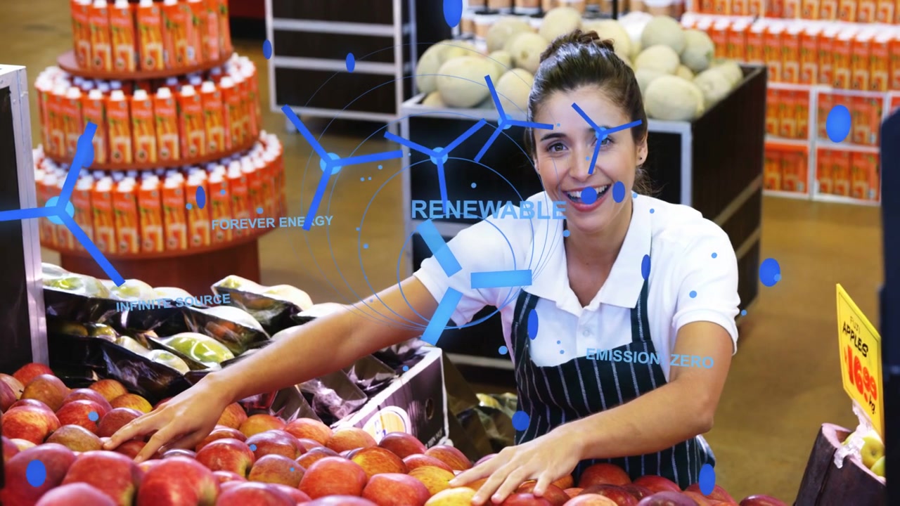Un commesso del reparto frutta e verdura si china, allunga la mano, fa scorrere e controlla le mele, sistemandole in una fila ordinata sotto una sovrapposizione AR blu