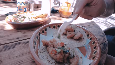 platting of tacos made with shrimp and fish