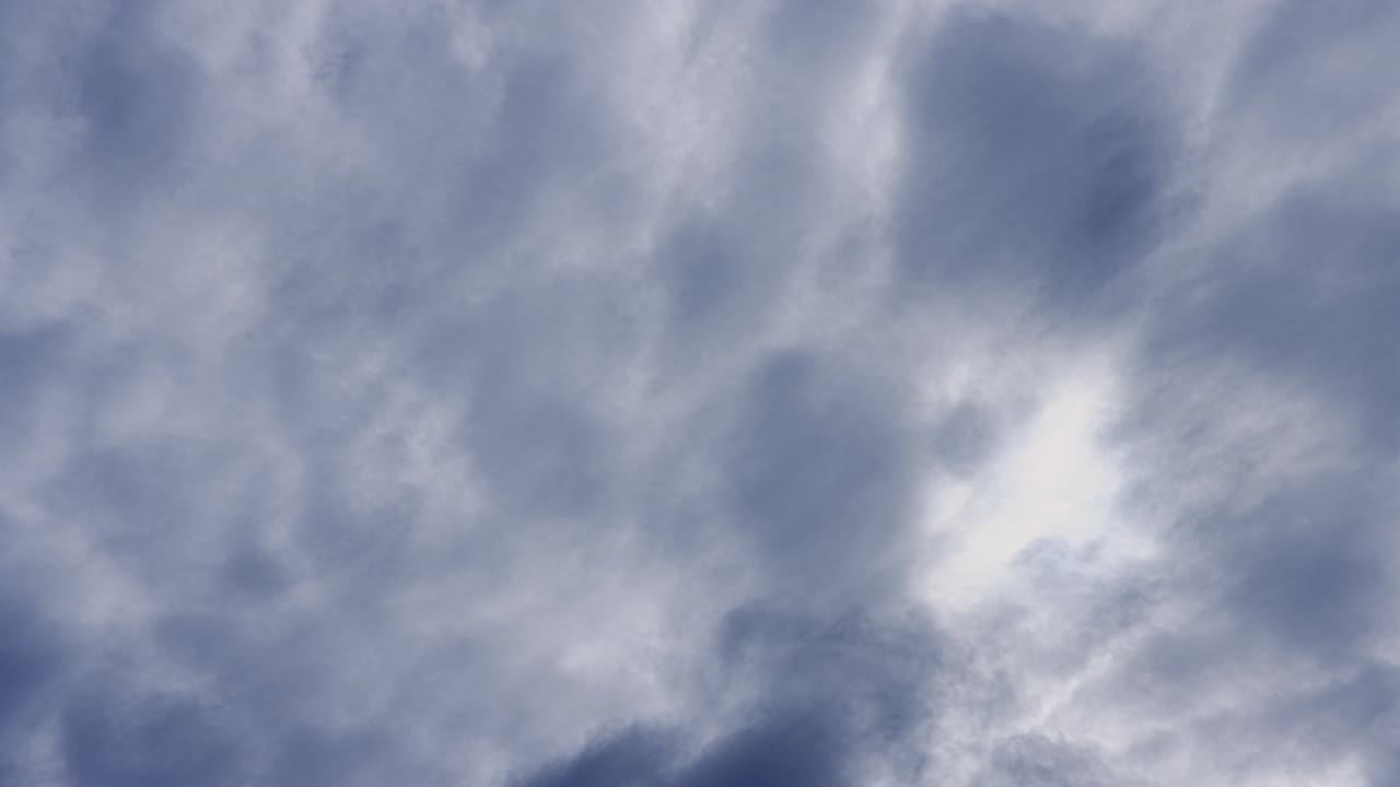 The sun shines through thick clouds that can also resemble smoke