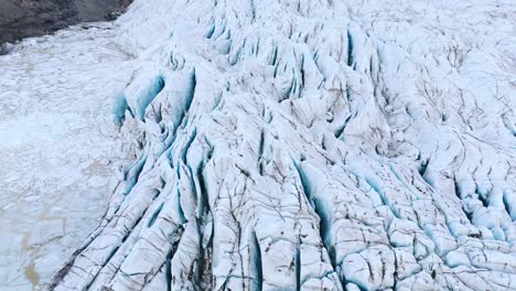 Frozen-glacier-ice-sheet-with-deep-crevasses-and-cracks-in-Iceland