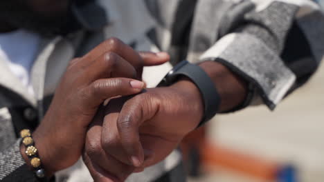 man checking time on apple watch