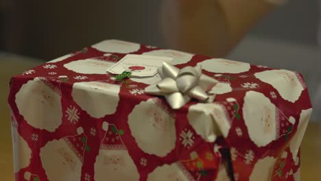 static shot of a name tag being stuck onto a christmas present