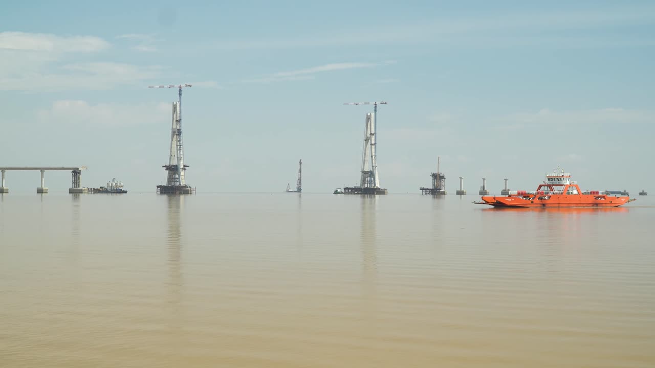Batang Lupar Sarawak River Ferry Ride View During Summer And Under Construction Longest Bridge Conecting From each side,Sarawak,Borneo.