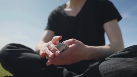 adult male shuffling and dropping a set of cards, captured in slow mo