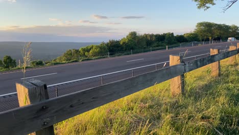 vehicles-driving-past-camera-on-highway-interstate-rest-stop