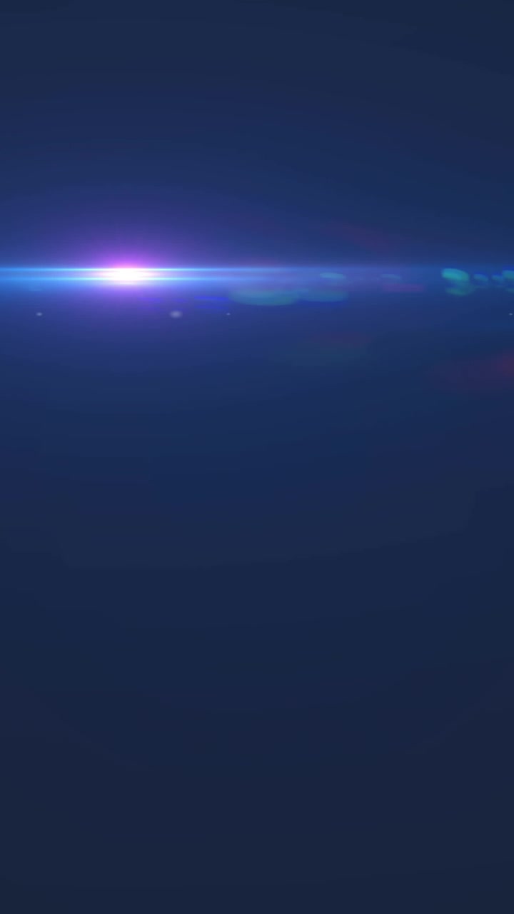 Animazione di luce rosa con raggio che si muove su sfondo nero.