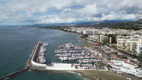 marbella coastline, port, boulevard and hotels in andalusia, spain - aerial