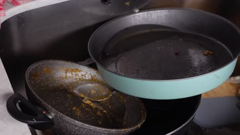 dirty dishes in kitchen sink