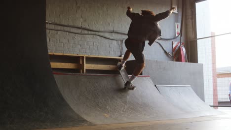 man skateboarding in cool studio 4k