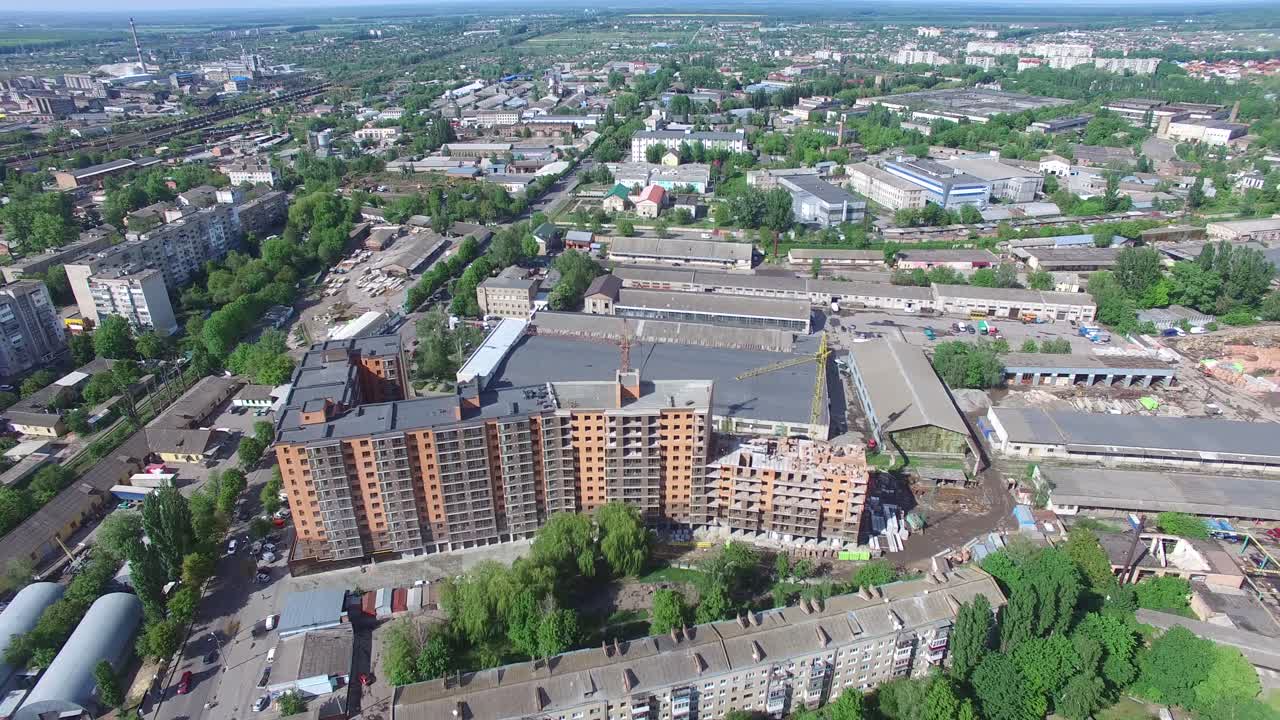 Aerial shot of the houses and streets of small city at day