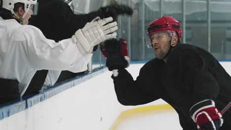Hockey Team Captain Giving High Fives To Players
