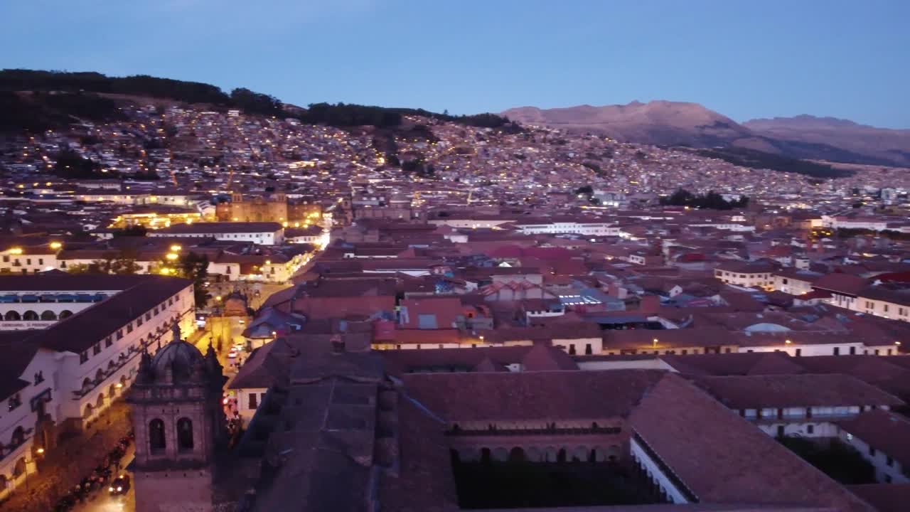 Panoramic view of the city of Cusco at Sunset in Peru - aerial drone shot
