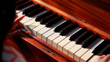 schoolgirl learning piano in music class 4k