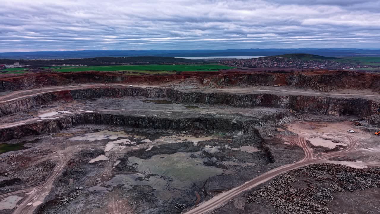 Granite quarry in industrial area with machinery and landscape view