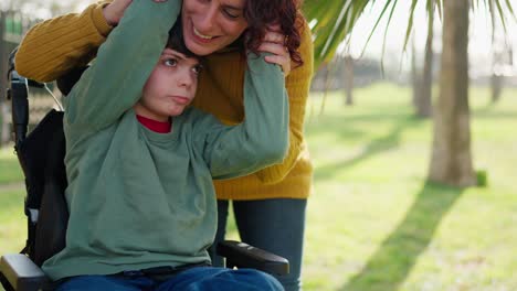 mother and child in wheelchair outdoors