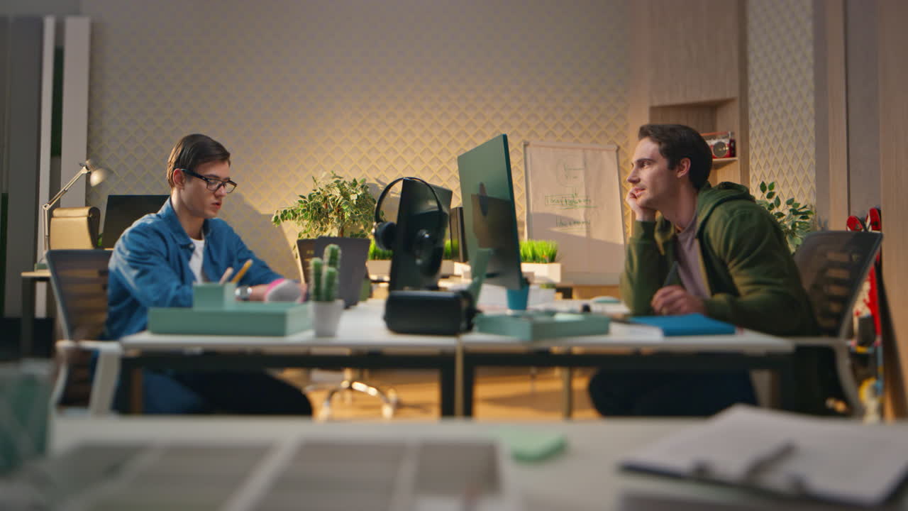 Smart startupers talking together at computer work room. Creative team working