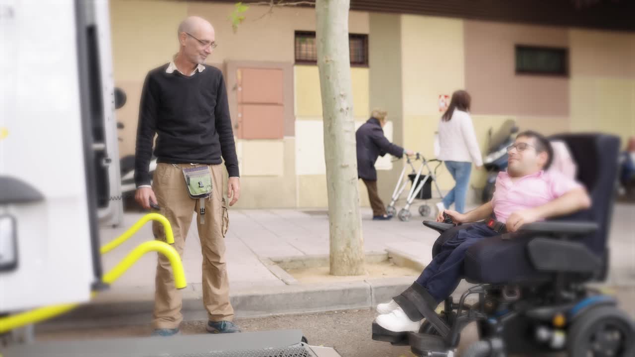 Man in wheelchair with caregiver