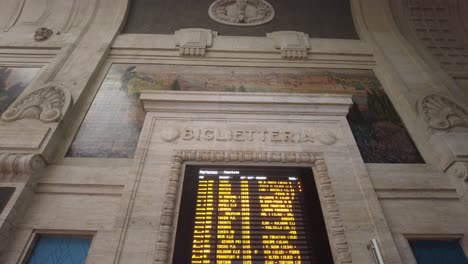 Milan,-Italy-train-station-inside-with-arrival,-and-departure-schedule-board