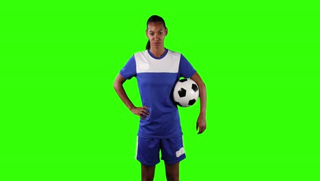 female soccer player on green screen