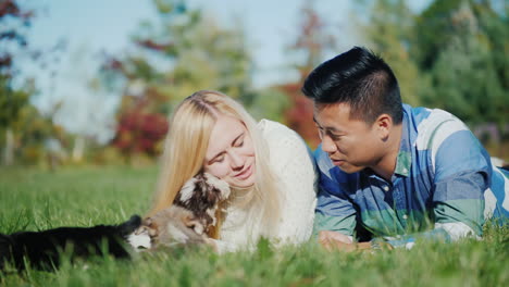 young couple and puppies