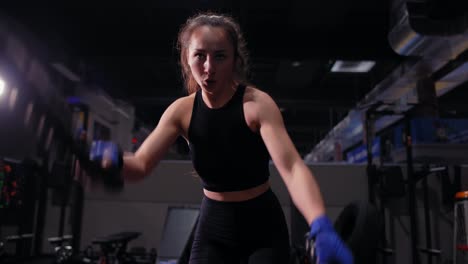 Athletic-Young-Woman-Doing-Some-Crossfit-Exercises-With-A-Rope-Indoor