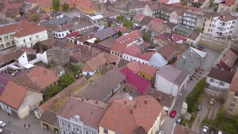 aerial drone shot over a charming romanian city full of old world architecture