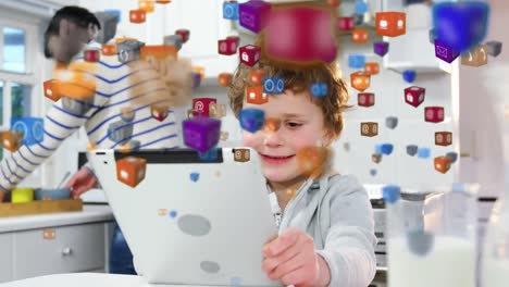 múltiples iconos digitales flotando contra el niño usando la tableta digital en casa