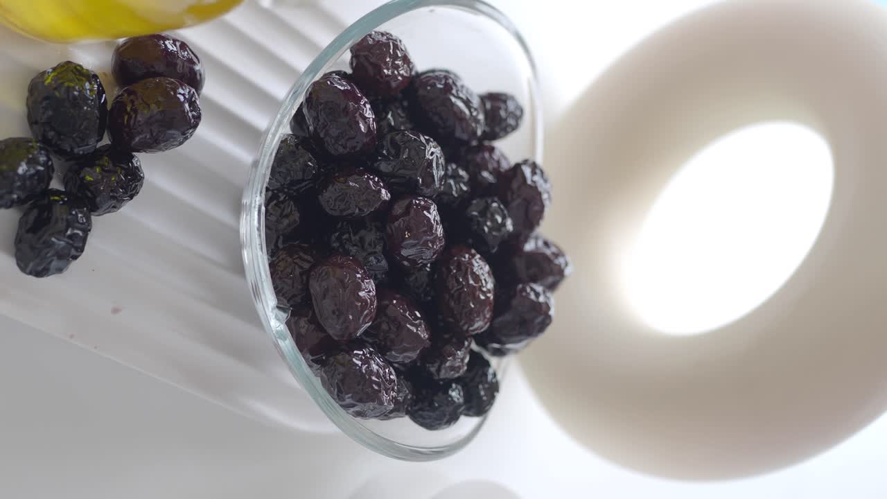 Dark Olives in Glass Bowl