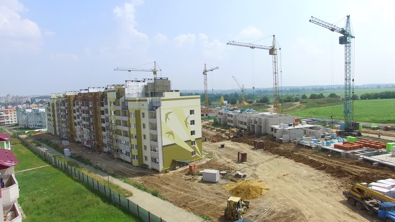 construction of boxes of modern high-rises at the initial stage in the city. Aerial view