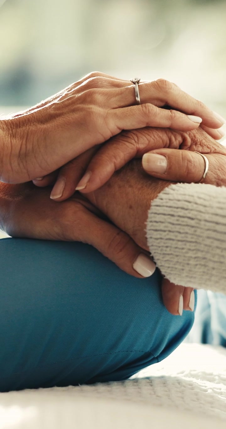 Close-up of a Caregiver Holding an Elderly Person's Hand