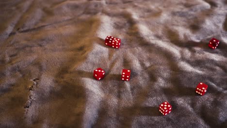 Picking-up-strewn-dice-off-of-felt