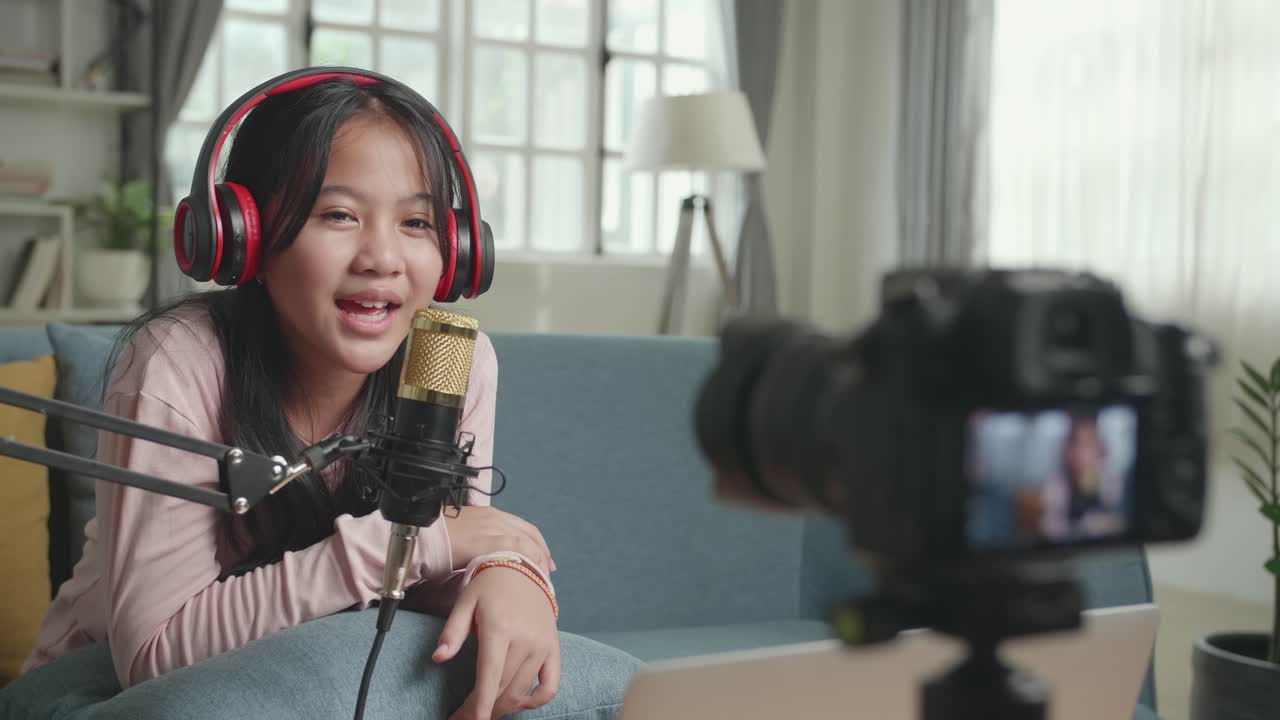 Young girl vlogging at home