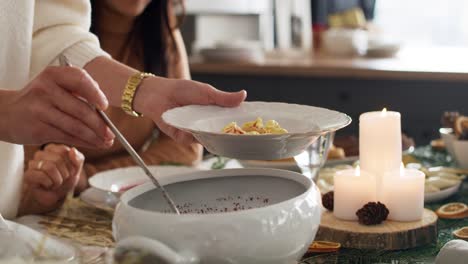 lose up of family sharing the christmas soup